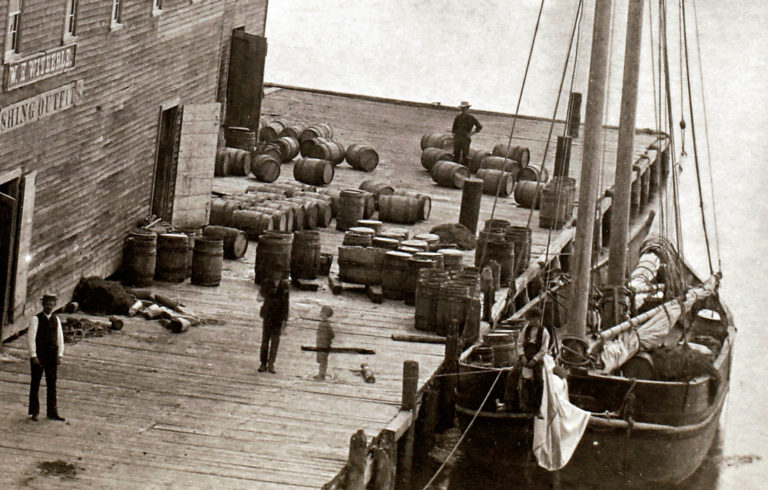 The W. H. Witherle & Co. dock and salt storage building in Castine. Research suggests the casks are filled with salt. PHOTO: COURTESY NEW ENGLAND HISTORIC GENEALOGICAL SOCIETY