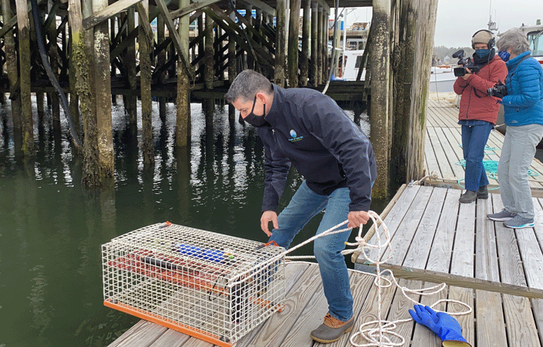 CAPTION: Friends of Casco Bay staff scientist Mike Doan launches a new continuous monitoring station in Harpswell. See story inside. PHOTO: COURTESY FRIENDS OF CASCO BAY