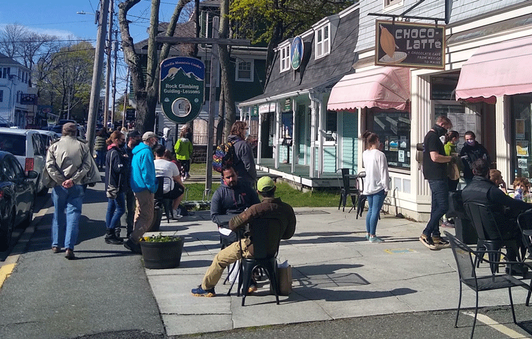 Folks enjoy tasty treats at Choco-Latte in downtown Bar Harbor on the first weekend in May, as tourism traffic gradually picks up. PHOTO: EZRA SCHREIBER-MACQUAID