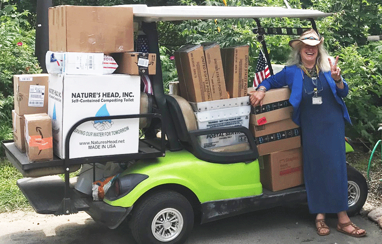 Joy Sprague in the golf cart she uses to pick up mail. PHOTO: COURTESY BARBARA FERNALD