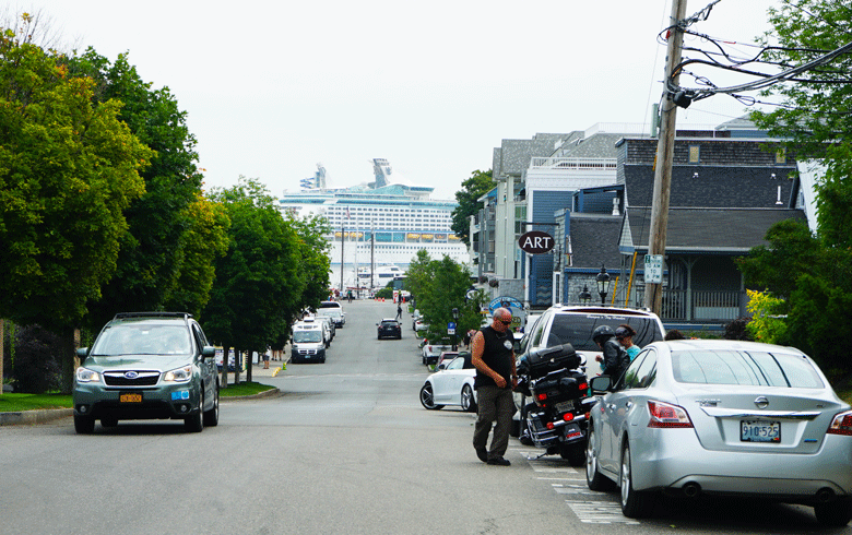 A cruise ship seems to loom over Bar Harbor's West Street. FILE PHOTO: TOM GROENING