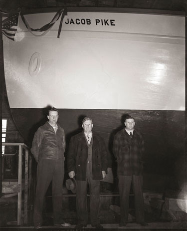 Launch day of the Jacob Pike at the Newbert and Wallace yard in Thomaston on April 28, 1949. From left: Lawrence Lord, engineer; Alfred Lord, mate; and Capt. Sherman Lord.