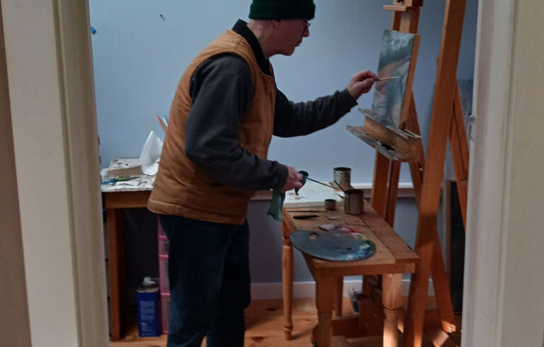 Landmesser at the easel in his Stockton Springs studio. Photo courtesy the artist.