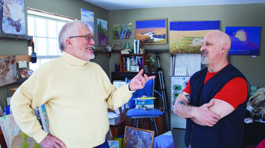 two men in an artists studio