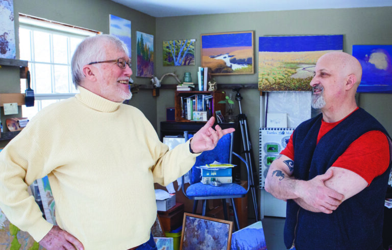 two men in an artists studio