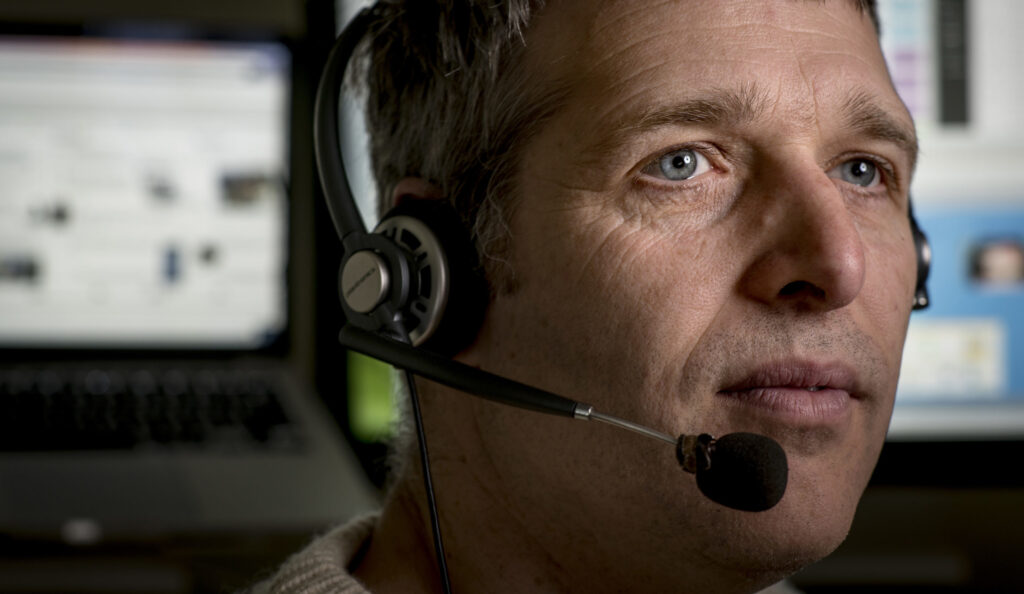 close up of man wearing headset