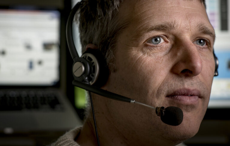 close up of man wearing headset