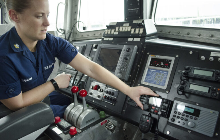 US coast guard woman working controls