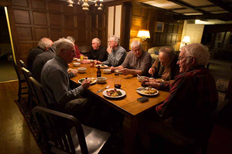 old men seated at a dinner table