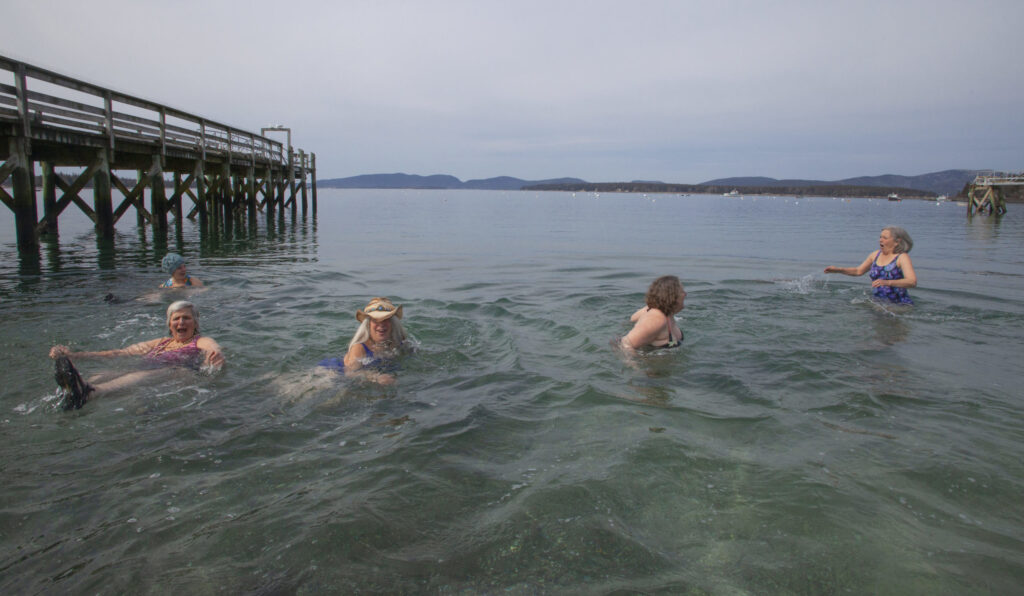 women swimming in the ocean