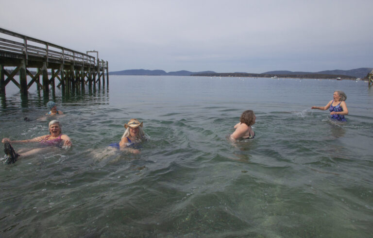 women swimming in the ocean