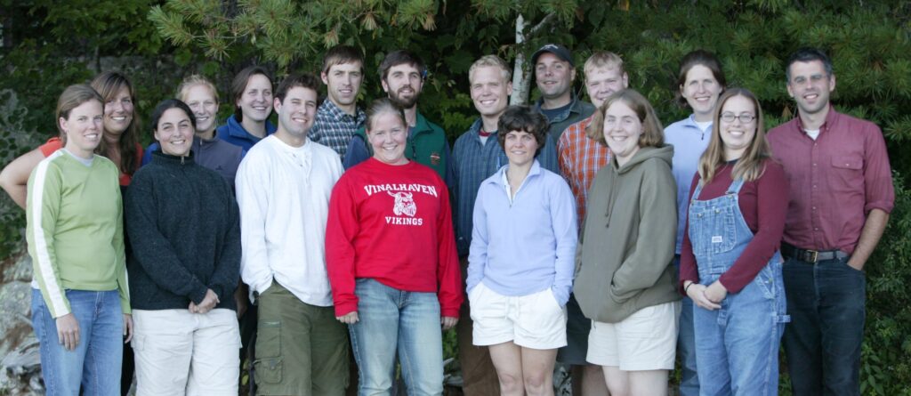 group of young adults in early 2000s clothing