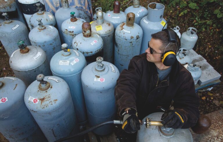 man with fuel tanks