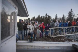 Vinalhaven athletes board Foy Brown's boat to return home.