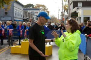 Gary Allen and Mary Ropp confer at the MDI Marathon finish line.