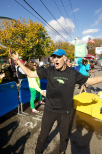 Gary revs up the crowd at the finish line