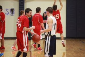 boys playing in a basketball game