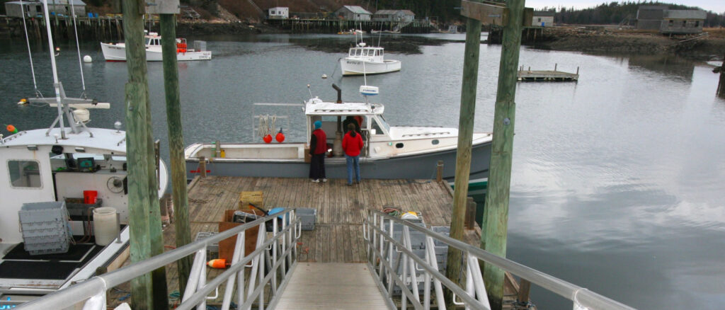 lobsterboats at the end of a dock