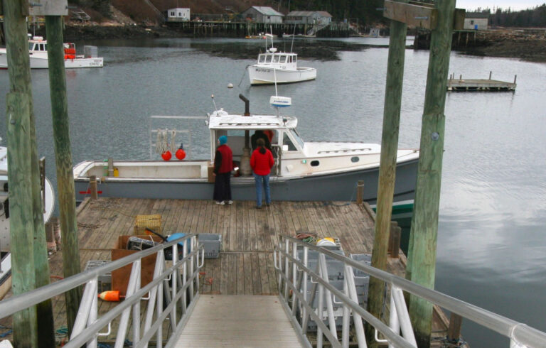 lobsterboats at the end of a dock