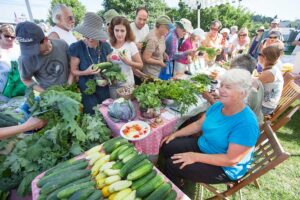 Kathie surveys the crowd at a farmer's market