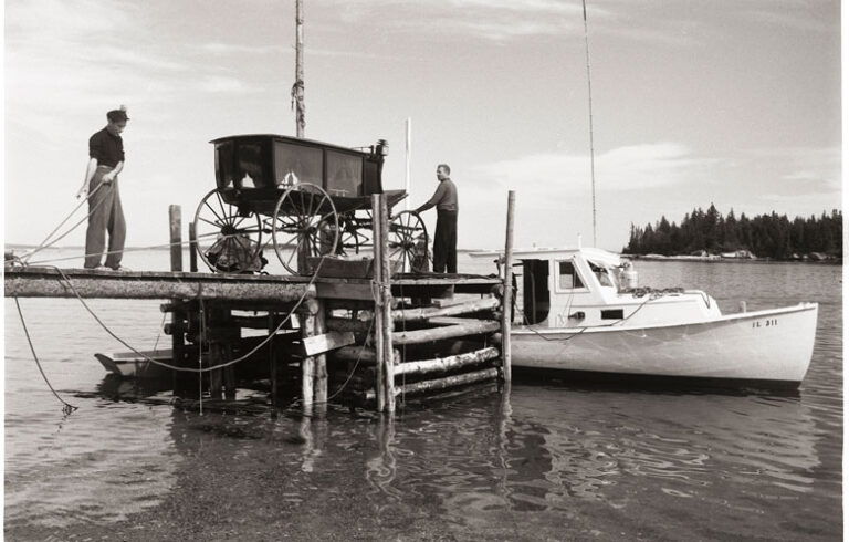 Andy Wyeth and the hearse in question being moved off Louds Island. PHOTO: KOSTI RUOHOMAA COLLECTION/PENOBSCOT MARINE MUSEUM