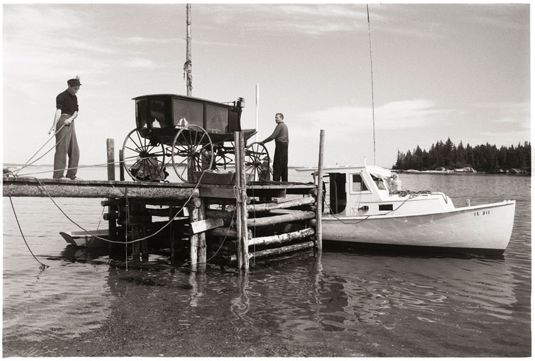 Andy Wyeth and the hearse in question being moved off Louds Island. PHOTO: KOSTI RUOHOMAA COLLECTION/PENOBSCOT MARINE MUSEUM