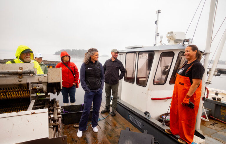 Lia Morris, center, on a mussel farm in Penobscot Bay. PHOTO: JACK SULLIVAN