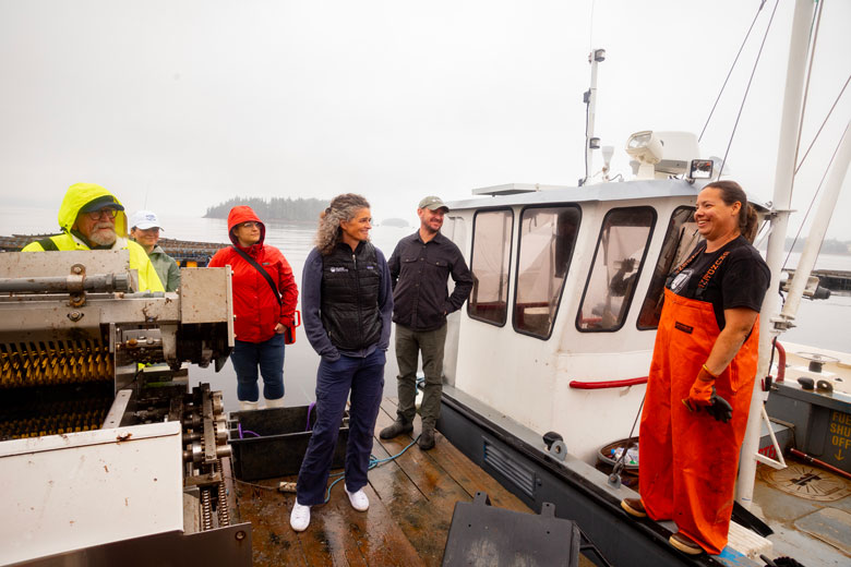 Lia Morris, center, on a mussel farm in Penobscot Bay. PHOTO: JACK SULLIVAN