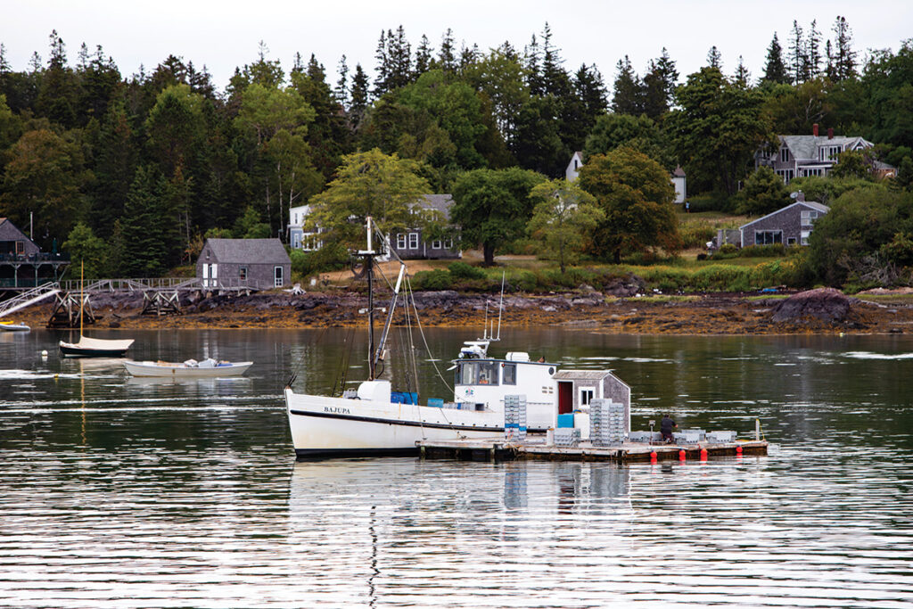 Boat tied up near landmass