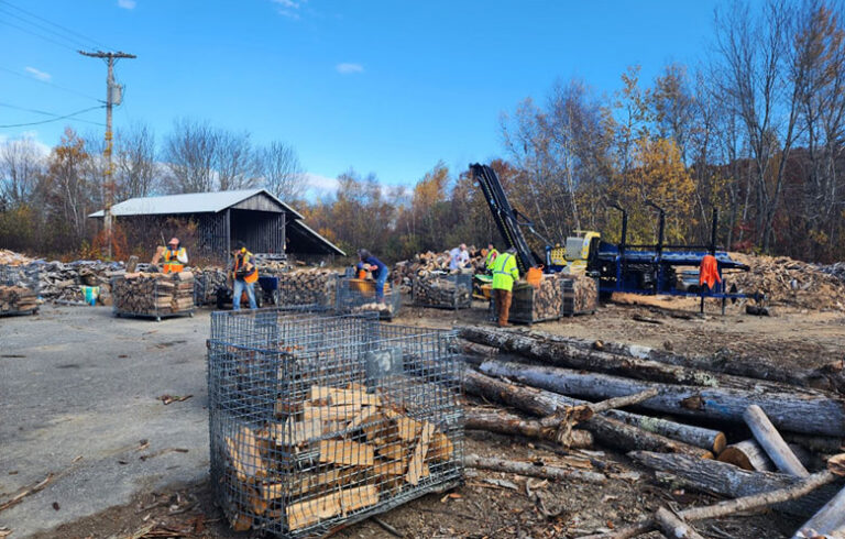 Volunteers with the Waldo County Woodshed work on cutting and stacking wood. PHOTO: COURTESY BOB MacGREGOR