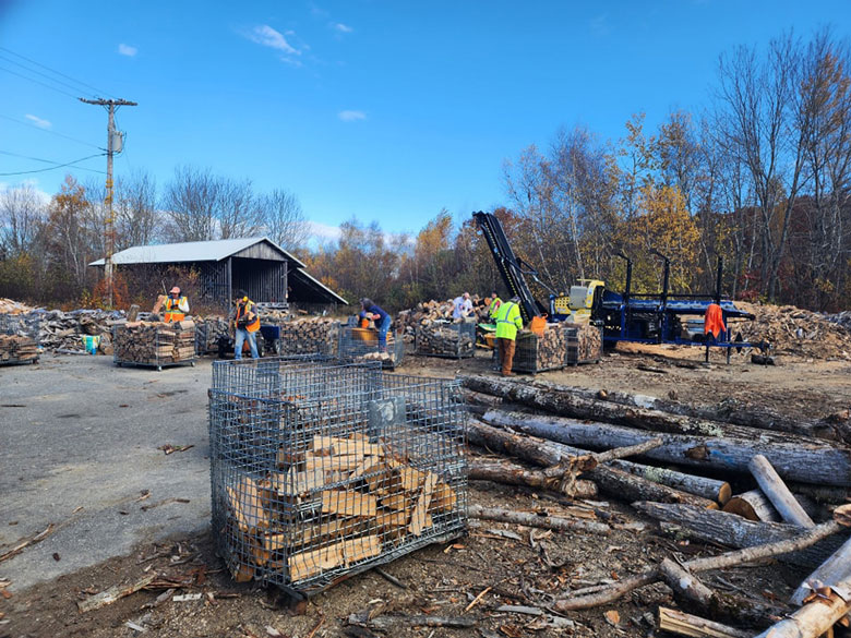 Volunteers with the Waldo County Woodshed work on cutting and stacking wood. PHOTO: COURTESY BOB MacGREGOR