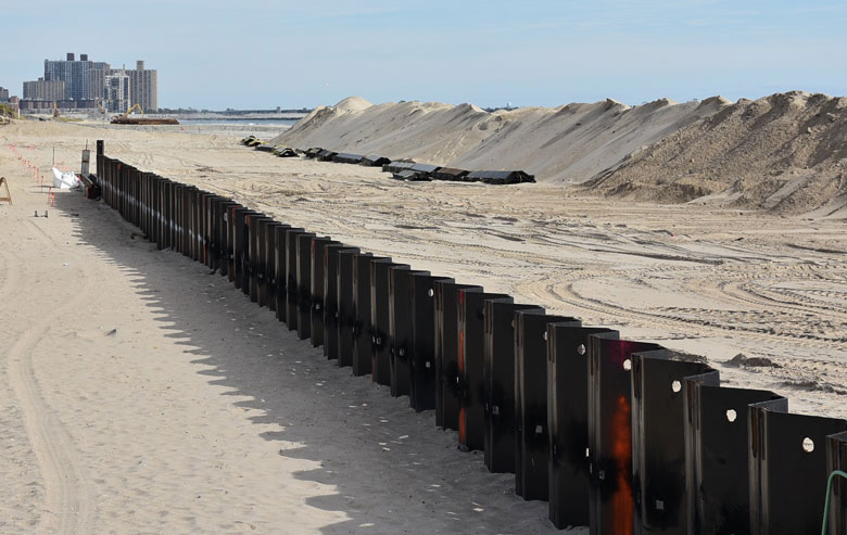 A seawall being built into a dune at Rockaway Beach in Queens, New York.