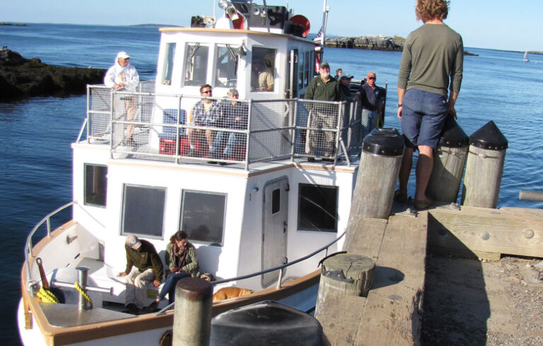 A boat arrives at the Monhegan pier. FILE PHOTO: TOM GROENING